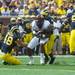 Central Michigan's halfback Zurlon Tipton is tackled by linebacker Cameron Gordon during the first quarter of their game, Saturday, Aug, 31.
Courtney Sacco I AnnArbor.com 